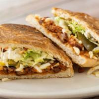 Torta · Mexican sandwich with lettuce, tomato, beans and sour cream.