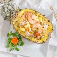 Pineapple Fried Rice · Fried rice with chicken and shrimp, egg, pineapple, onion, tomatoes, carrot, and cashew.
