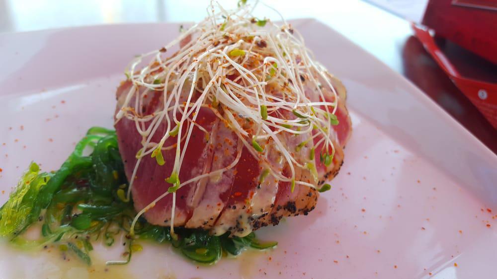 Tuna Tataki · Marinated seared red tuna served over seaweed salad, honey wasabi, and sprouts.

*Consuming raw or undercooked meat, poultry, seafood, shellfish or eggs may increase the risk of foodborne illness.