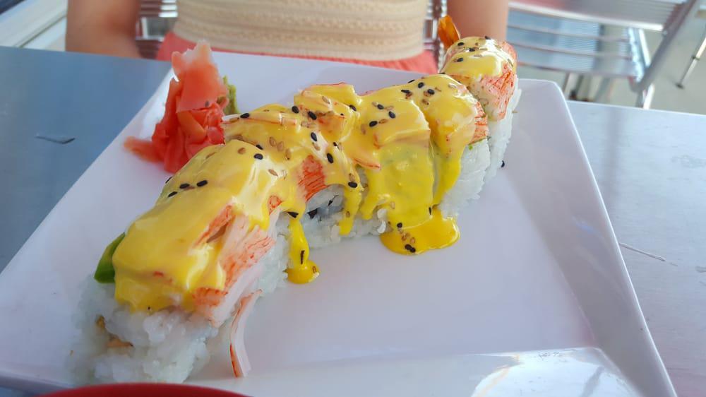 Wild Caterpillar Maki · Tempura shrimp, cucumber, cream cheese, topped with avocado, crab, sesame seeds, and spicy mayonnaise.