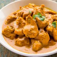 Butter Chicken · Boneless chicken breast cooked in a rich creamy tomato sauce with cashew nuts, spices, and o...