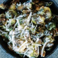 Brussels Sprouts · Roasted garlic sauce, parmesan.