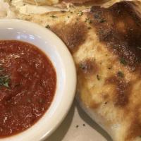 Meat Lovers Calzone · Pepperoni, Italian sausage, Canadian bacon and hamburger with ricotta and mozzarella cheese ...