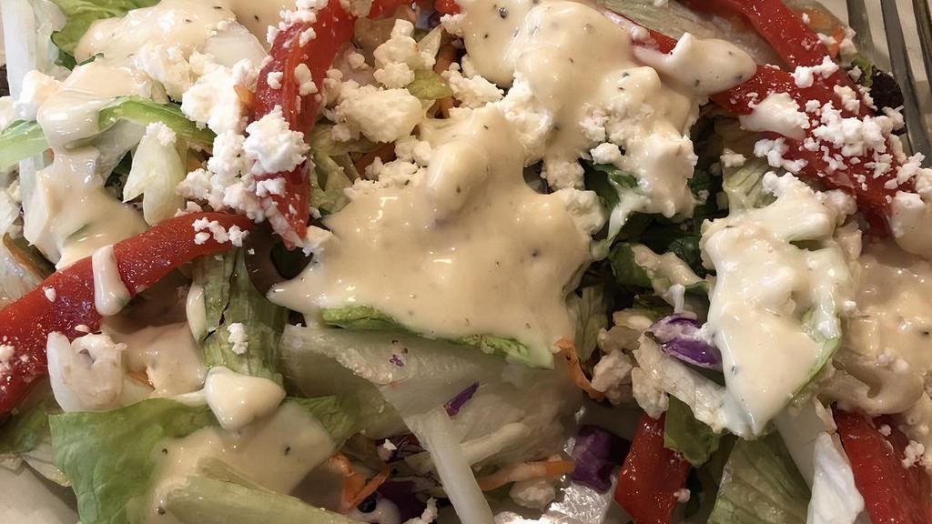 Greek Salad · Fresh mixed greens, feta cheese, black olives, onions, roasted peppers, and olive oil.
