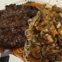 Steak Marsala · Ribeye with sautéed fresh mushrooms in a marsala wine sauce Served with a side of spaghetti.