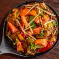 In36. Beef Karahi · Beef marinated and cooked with onions, ginger, bell pepper, tomatoes and house made gravy.