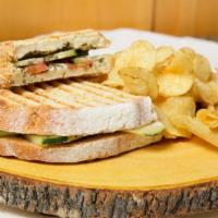 Trans-Siberian Sandwich · Grilled sourdough smothered in melted brie, layered with ripe roma tomato, fresh basil, cris...