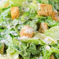 Caesar Salad · Romaine lettuce, tomatoes and shaved parmesan with Caesar dressing and croutons.