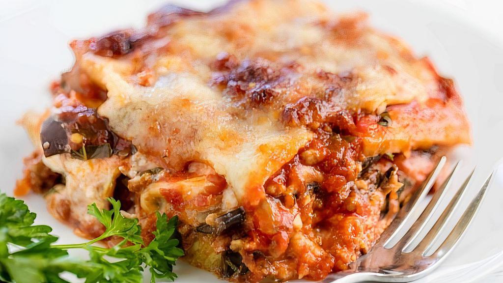 Lasagna · Layers of spinach and three cheeses topped with our meat or marinara sauce.