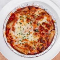 Baked Rigatoni · Rigatoni in a marinara sauce baked with Mozzarella topped with grana padano. Served with gar...