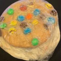 M&M Cookie/Cookie Dough Ice Cream · Cookie dough ice cream in-between two M&M cookies.