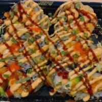 Yamato Roll (6) · Deep fried spicy salmon, cream cheese, avocado topped with spicy mayo, eel sauce, and tobiko.