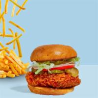 Naughty Nashville Crispy Chicken Sandwich · Crispy chicken, sliced tomatoes, shredded lettuce, jalapenos, and nashville hot sauce wrappe...