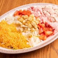 Chef'S Salad · Loaded with ham and turkey, tomatoes, onions, cheddar cheese & croutons.