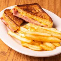 Grilled Ham & Cheese · Piled high thinly sliced ham and cheese on grilled texas toast.