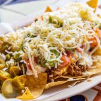 Nacho Supreme · Choice of meat expect lengua or steak. Beans, tomatoes, shredded cheese, nacho cheese, jalap...