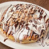 S'Mores Pancakes · Three pieces of pancakes stuffed with chocolate chips, graham cracker, and marshmallow fluff...