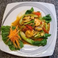 Yellow Curry Seafood Stir Fry · A combination of shrimp, scallops, squid, mussels and crab meat sautéed with scallions, napa...