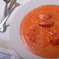Butter Chicken · Boneless pieces of white meat chicken cooked in tomato based sauce with butter and fenugreek...