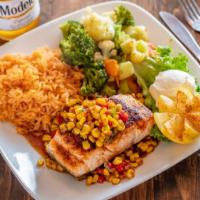 Lemon Grilled Salmon · Served with corn salad, rice, sour cream.