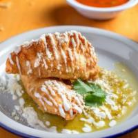 Empanadas · Two pastry turnovers lightly fried to a golden stuffed with veggies.