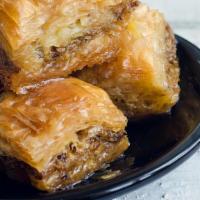 Baklava · Layers of phyllo dough filled with chopped nuts, sweetened with honey