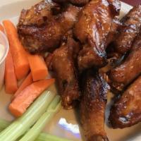 Indy-Style Hot Wings (20 Pieces) · Jumbo-sized wings, fried, grilled or ricky bobby. Served with carrots, celery and your choic...