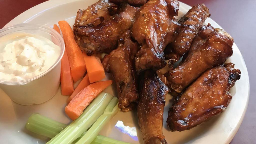 Indy-Style Hot Wings (20 Pieces) · Jumbo-sized wings, fried, grilled or ricky bobby. Served with carrots, celery and your choice of bleu cheese or ranch for dipping.