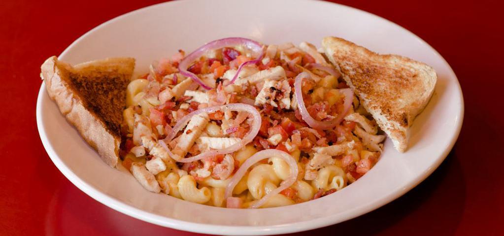 Gourmet Mac & Cheese · This one is nobody’s second fiddle! we start with our made from scratch mac ‘n’ cheese and top it with grilled chicken, bacon bits, caramelized red onions and diced tomatoes. Served with garlic toast.