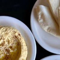 Hummus (Gf W/ Corn Chips & V) · Housemade hummus served with pita bread, or corn chips. GF with corn chips.  Vegan, gluten f...