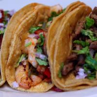 Pastor, Steak, Crab, Chorizo Or Shrimp Tacos (3) · Topped with lettuce, tomatoes. Comes with rice and beans.