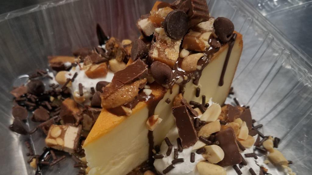 Peanut Fantasy  Cheesecake Sundae · Cheesecake, caramel sauce, chocolate sauce, whipped cream, salted peanuts , Chopped Snickers & Reese's Cup