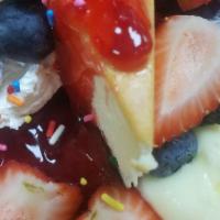 Berry-Licious Cheesecake Sundae · Cheesecake, strawberry compote, raspberry compote, lemon compote,  whipped cream, & fresh mi...