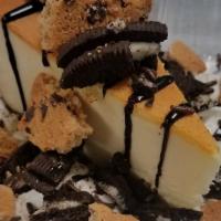 Cookies & Cream Cheesecake Sundae · Cheesecake with whipped cream, chopped Oreo's, Chips Ahoy and chocolate sauce.