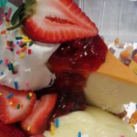 Tutti Frutti Cheesecake Sundae · Cheesecake with lemon, raspberry compote, fresh strawberries, whipped cream and fruity pebbl...