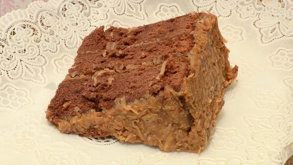 German Chocolate Cake Slice · Bestseller and signature cake! Our delicious German chocolate cake and German chocolate icing! (contains nuts).