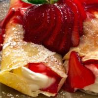 Strawberry Crespelle · Two thin Italian style crepes layered with rich vanilla custard, then folded and covered in ...