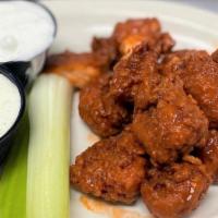Boneless Wings · Boneless buffalo wings tossed in your choice of mild, spicy, or honey bbq sauce. served with...