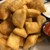 Dough Nuggets · bite-sized pieces of fried pizza dough tossed in a parmesan garlic butter sauce and served w...