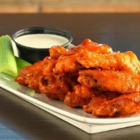 Buffalo Wings · marinated, slow roasted, and fried to order. tossed in your choice of mild, spicy, or honey ...