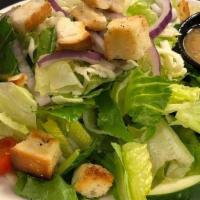 House Salad · romaine and iceberg lettuce topped with mozzarella cheese, cucumbers, tomatoes, red onion, a...