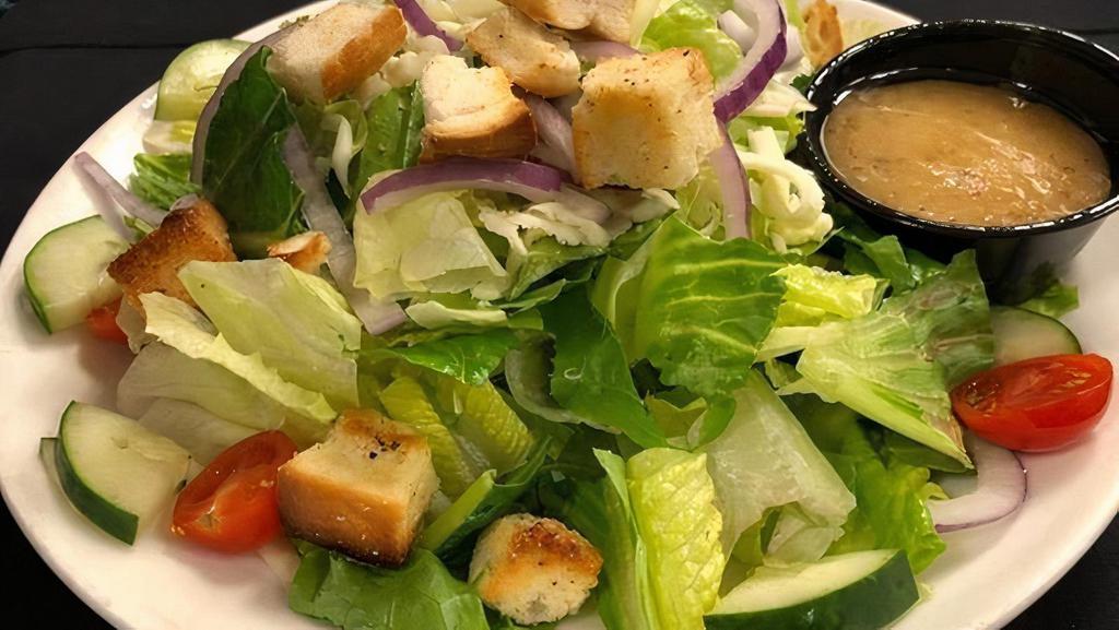 House Salad · romaine and iceberg lettuce topped with mozzarella cheese, cucumbers, tomatoes, red onion, and croutons.