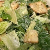 Side-Caesar Salad · romaine lettuce, parmesan cheese, and croutons all tossed with a creamy caesar dressing.