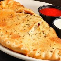 Calzone · Pizza dough topped with marinara sauce, mozzarella cheese, and your favorite pizza toppings,...