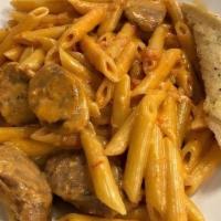 Sausage Vodka Sauce · grilled Italian sausage and our spicy vodka sauce tossed with penne pasta and parmesan chees...