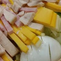 Small Chef Salad · Tomato, cucumber, ham, turkey, swiss and American cheese, and hard boiled egg.