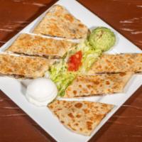Quesadilla Grande · 3 flour tortilla stacked with cheese and a choice of steak, chicken, pastor, vegetables, cho...