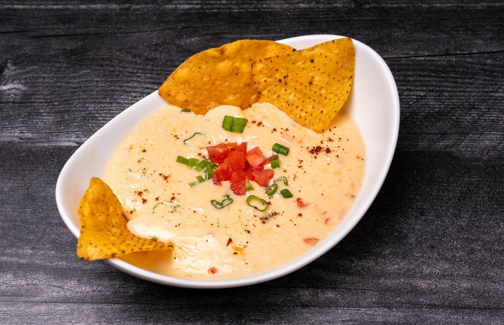 Cheese Dip W/ Chips · Our homemade signature cheese sauce