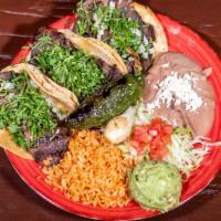 Lomo Taco Dinner · 3 thin cut rib-eye tacos served with a side of gaucamole, grilled jalapenos and grilled onio...