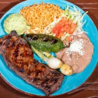 Arrachera · Charbroiled seasoned skirt steak with grilled jalapenos and onions. Served with guacamole, r...